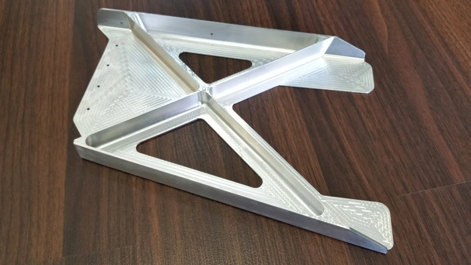 Contoured aerospace bracket with compound machined angles.