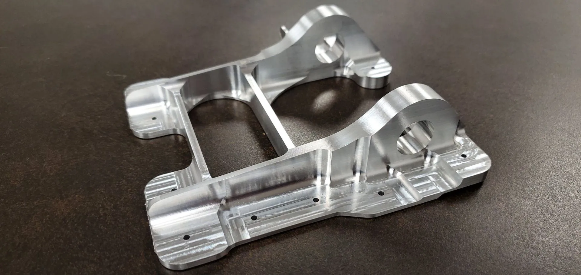 Precision-machined component with deep, accurately positioned bores.