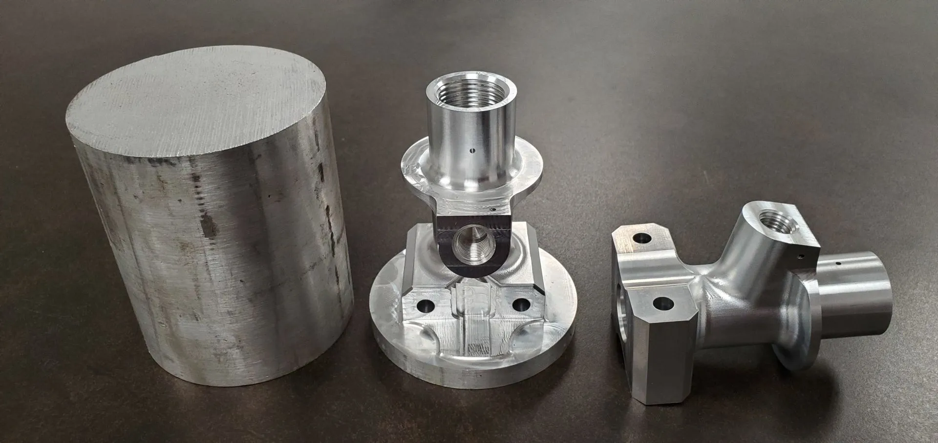 Repeat production run of precision-machined aerospace components in staged rows.